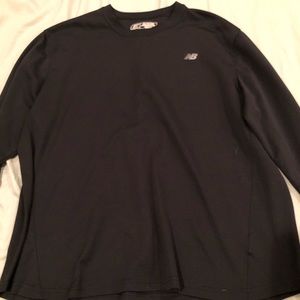 Black Dri fit New Balance shirt.